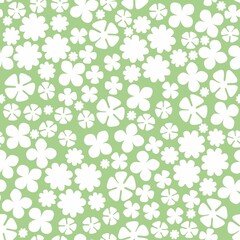 Floral monochrome seamless pattern. Different white flowers on light green background. Raster fashion print