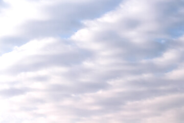 Naklejka na ściany i meble White cloudy full on blue sky background