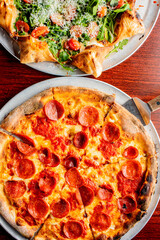 Pizza. Cheese Pizza. Traditional New York City style margarita pizza pie with a thin homemade crispy crust, tomato, garlic, marinara sauce topped with buffalo mozzarella cheese and fresh basil leaves.