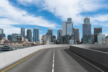Naklejka na ściany i meble Empty urban asphalt road exterior with city buildings background. New modern highway concrete construction. Concept way to success. Transportation logistic industry fast delivery. Seattle. USA.