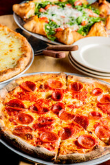 Pizza. Cheese Pizza. Traditional New York City style margarita pizza pie with a thin homemade crispy crust, tomato, garlic, marinara sauce topped with buffalo mozzarella cheese and fresh basil leaves.