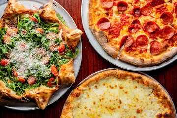 Pizza. Cheese Pizza. Traditional New York City style margarita pizza pie with a thin homemade crispy crust, tomato, garlic, marinara sauce topped with buffalo mozzarella cheese and fresh basil leaves.