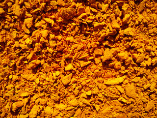 Full frame shot of turmeric powder drying under sun