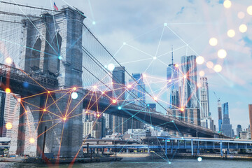 Fototapeta premium Brooklyn bridge with New York City Manhattan, financial downtown skyline panorama at day time over East River. Social media hologram. Concept of networking and establishing new people connections