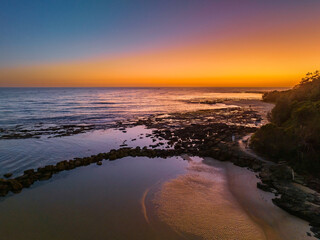 Sunrise over the sea and bay with clear skies