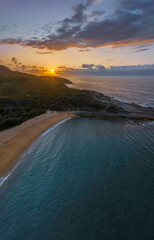 Fototapeta premium Rain cloud sunrise over the beach and mountain