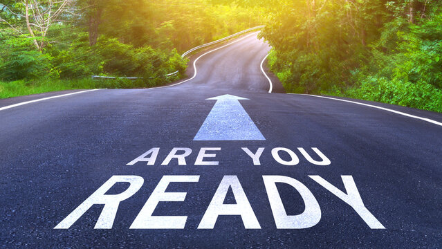Are you ready written on the middle of the asphalt curve road. Are you ready Write on the road in the middle of the empty asphalt road