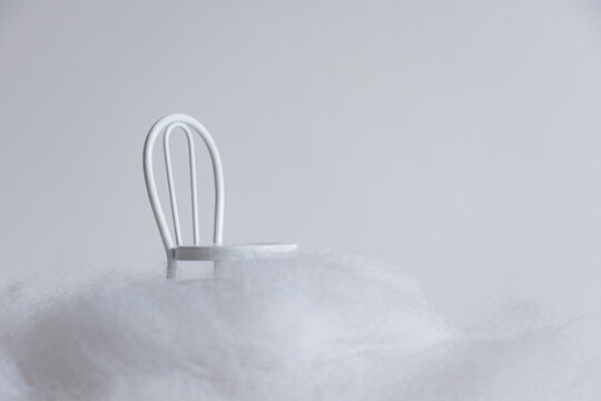 miniature chair on white background with clouds