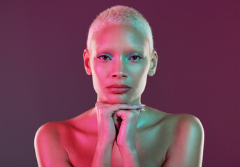 Skincare, beauty and portrait of woman with neon makeup and lights in creative advertising on studio background. Cyberpunk, product placement and model isolated for futuristic skin care mockup space.