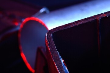 metal scraps. Macro. illuminated in red and blue.