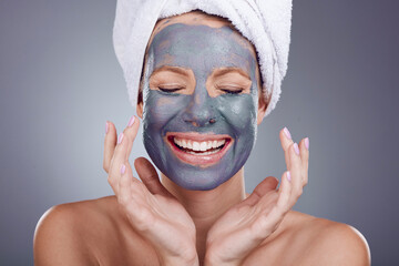 Woman, clay makeup and beauty mask of facial, detox dermatology and studio background. Happy female...