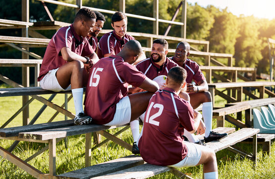 Rugby, break and team of sports men talking, relax and share ideas for training at a field. Fitness, friends and man group discuss game strategy before match, workout and planning practice in huddle