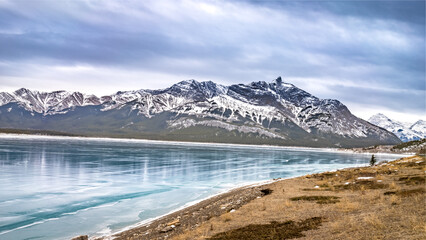 Frozen Abraham lake with clear ice landscape in winter season cloudy day , Alberta, Canada