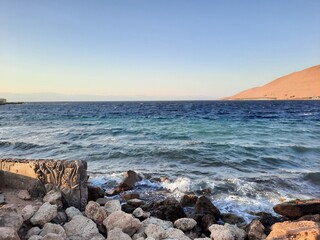 The mesmerizing view of the deep blue waters of Haql beach in Saudi Arabia.
