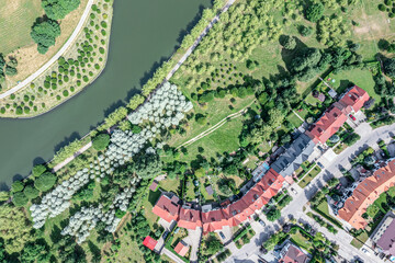 aerial top view of city residential area of private houses along the river