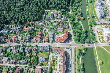 aerial view of city residential area near the river in sunny summer day