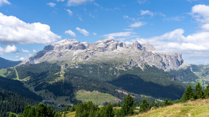 Fototapeta na wymiar Amazing landscape at the Dolomites in Italy. View at Sella group during summer time. dolomites unesco world heritage. Best touristic destination. Alta Badia, Sud Tirol, Italy