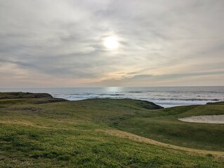 sunset over the Pacific Ocean, sunset in Half Moon Bay State Beach cliff side landscape