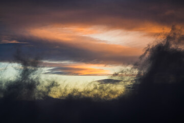 Amazing sunrise sky landscape. Clouds in spectaculare shapes and color during an orange vivid color sunrise view. Great for wallpaper and background image.