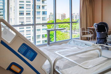 Hospital bed and a place for a newborn baby.