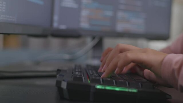 Close Up Of Teen Girl Programmer'S Hands Typing On Desktop Computer Creating Software Engineer Developing App, Program, Video Game At Home. Terminal With Coding Language 
