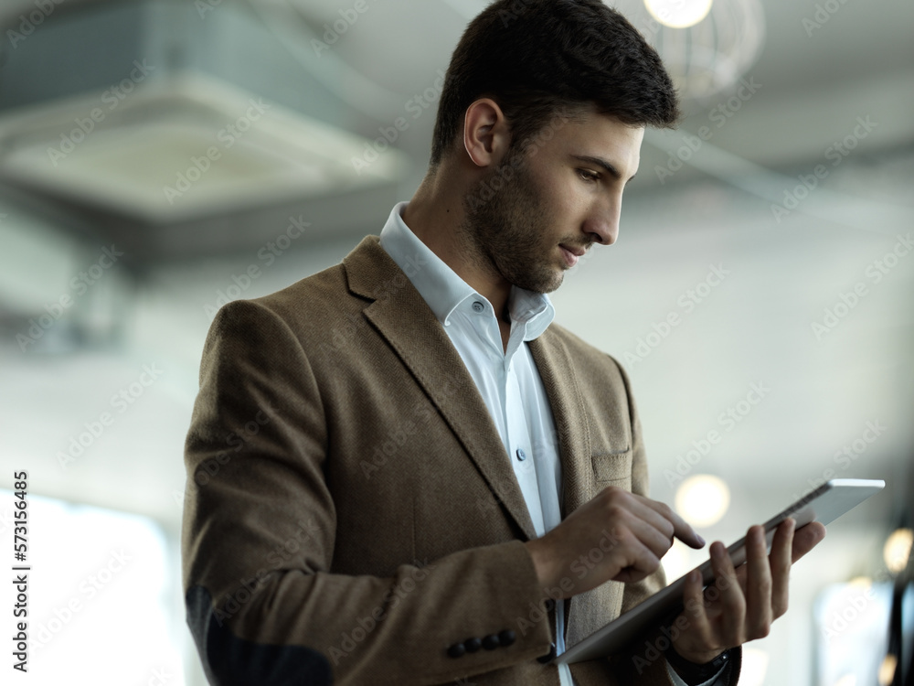Poster Technology, internet and businessman with tablet reading email, sales report or website statistics. Research, leadership and company ceo networking, online communication management at startup office.