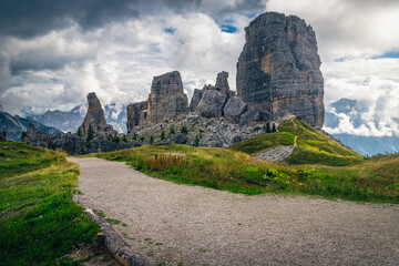 Wide pebbly hiking trail and Cinque Torri rock formations, Dolomites