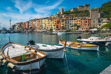 Colorful buildings and fishing boats in harbor, Porto Venere, Italy