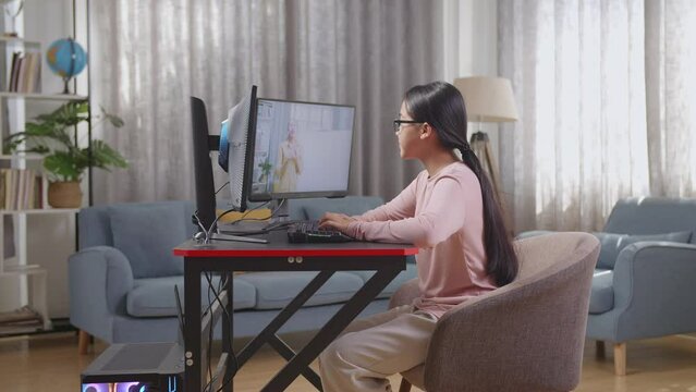 Asian Teen Girl Programmer Learning Online From Teacher On Desktop Computer While Creating Software Engineer Developing App, Program, Video Game At Home. Terminal With Coding Language 
