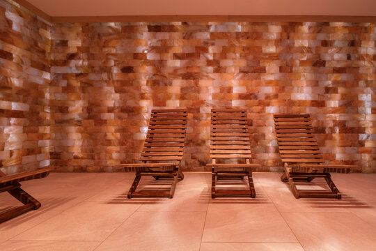 interior of modern wellness salt haloper cave with uv light with wooden bench