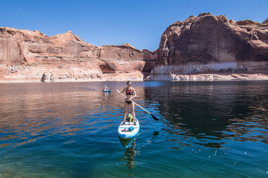 Woman paddleboarding on lake, Utah, USA
