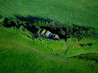 aerial shot of gras covered huts at the Thjorsar Valley in south Iceland