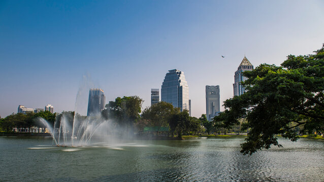 Fountain in lake at Lumphini Park, Bangkok, Thailand