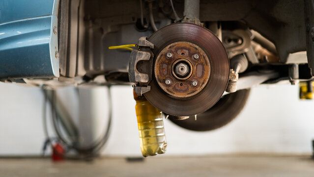 Automatic change of brake fluid in a car service. 