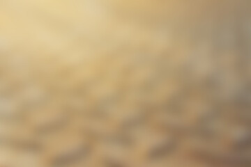 Beautiful blurred sand on beach and sun lighting for brown or natural background. 