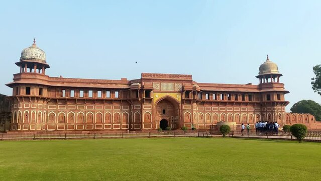 The famous red fort in the city of Agra, India. Tourists visit a popular tourist attraction.