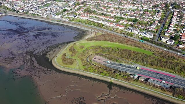 Aerial footage of the town of Deganwy in Conwy County Borough in Wales It lies in the Creuddyn Peninsula alongside Llandudno Rhos-on-Sea showing the A55 North Wales Expressway along the Conwy river