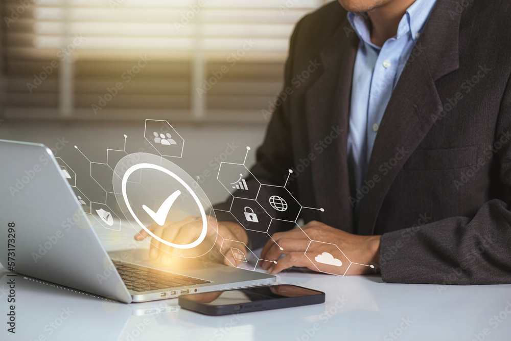 Poster businessman working on labtop with check mark symbol and standard quality control. the concept of in