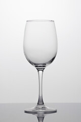 Empty wine glass close-up, isolated in backlight