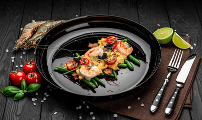 Omelet with shrimp, caviar and grilled tomatoes on a bed of green beans and bacon