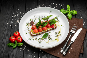 Delicious bruschetta with cream cheese, gluacomoli sauce and cherry tomatoes