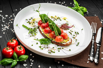 Delicious bruschetta with cream cheese, gluacomoli sauce and cherry tomatoes