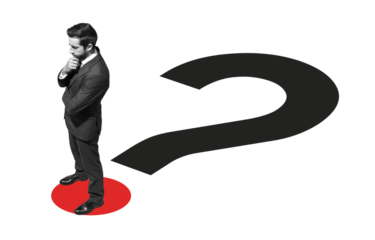 Corporate businessman standing on a question mark