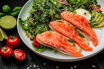 Salted salmon on croutons with fresh salad and cream cheese