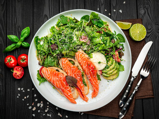 Salted salmon on croutons with fresh salad and parmesan cheese