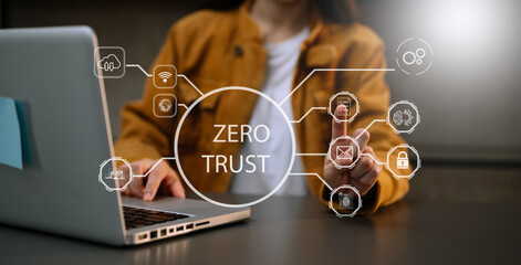 Zero trust security concept Person using computer and tablet with zero trust icon on virtual screen...