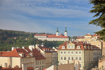 Naklejka na ściany i meble Distant view of the monastery of Strahov over the city of Prague, Czech Republic.