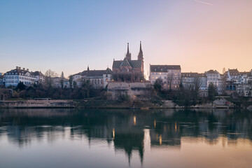 Fototapeta premium Beautiful sunset on the banks of the Rhine River, in the city of Basel, Switzerland.