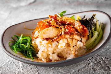 fish with Rice and Vegetable in bowl. donburi