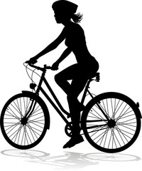 Bicyclist riding their bike and wearing a safety helmet in silhouette